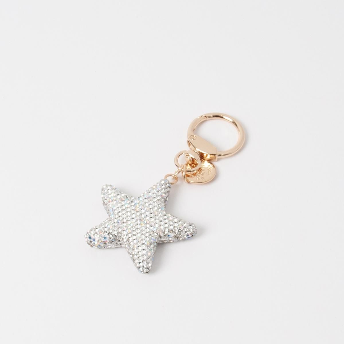 Hopeinen glittertähti-laukkukoru, metalliklipsillä kiinnitettävä koriste laukkuun tai avaimenperään