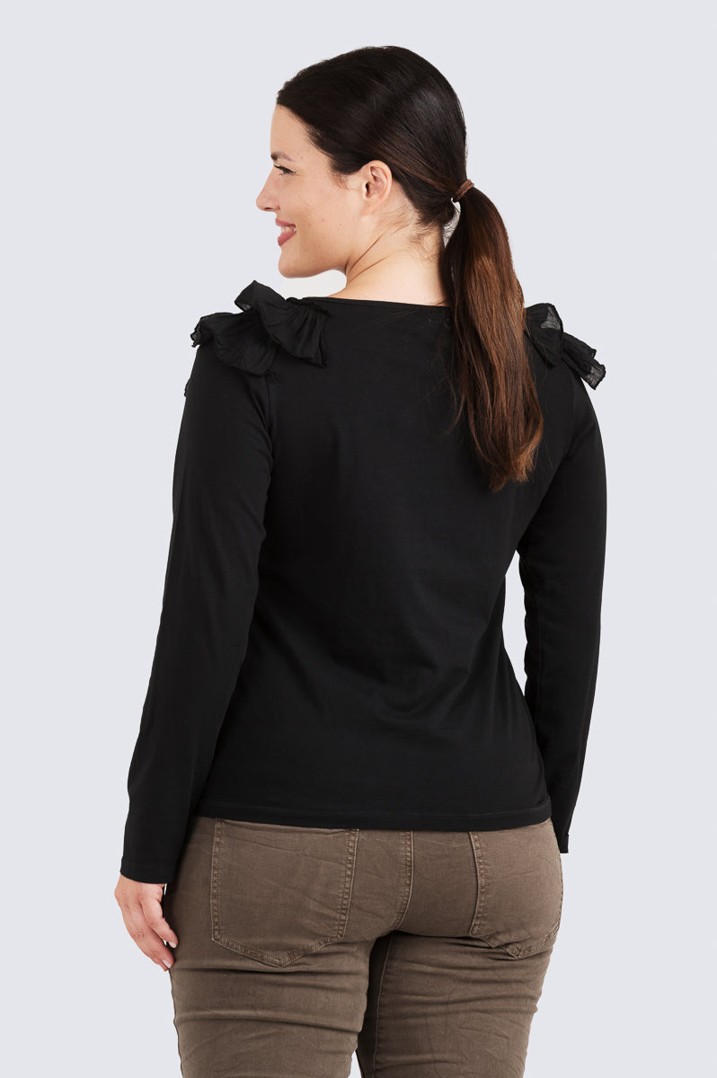 Rimpsutrikoopusero – Kotirouva, joustavaa trikoota, kevyet kangasröyhelöt ja V-pääntie.